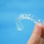 Hand holding clear plastic retainer teeth Stock Photo by ©Bhubeth ...