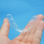 Hand holding clear plastic retainer teeth Stock Photo by ©Bhubeth ...