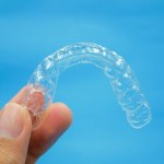 Hand holding clear plastic retainer teeth Stock Photo by ©Bhubeth ...