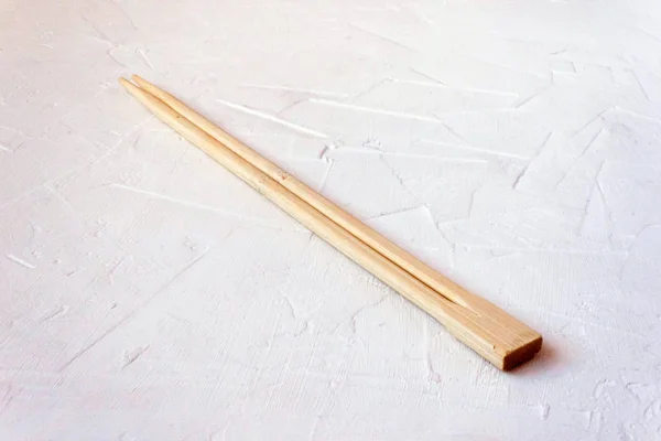 Wooden Chinese sticks on white background