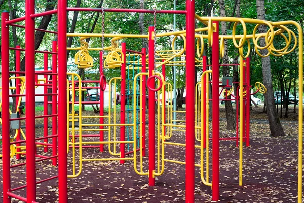 Metal children's outdoor playground equipment bars swing yellow and red color