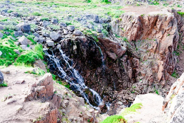 Beautiful summer day landscape waterfall North Teriberka, Barents sea view.