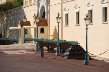 old medieval cannons in front of the royal palace of Monaco clipart