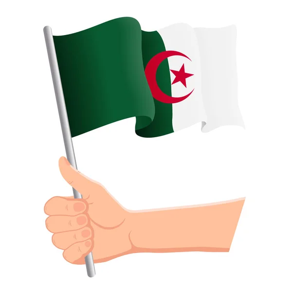 Hand holding and waving the national flag of Algeria. Fans, independence day, patriotic concept. Vector illustration — Stock Vector