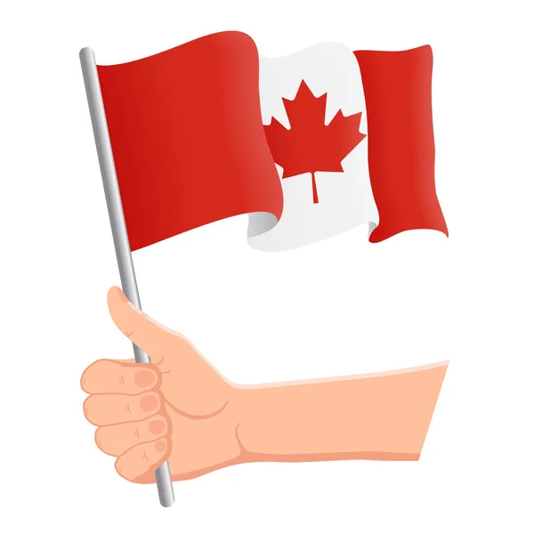 Tenendo la mano e sventolando la bandiera nazionale del Canada. Ventilatori, giorno dell'indipendenza, concetto patriottico. Illustrazione vettoriale — Vettoriale Stock