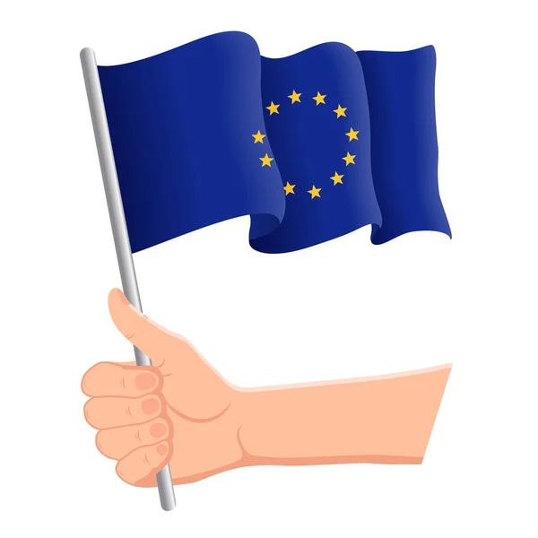 Hand houden en zwaaien de nationale vlag van de Europese Unie. Fans, Independence Day, patriottische concept. Vector illustratie — Stockvector