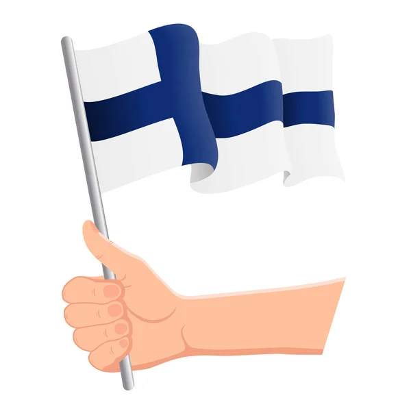 Hand houden en zwaaien de nationale vlag van Finland. Fans, Independence Day, patriottische concept. Vector illustratie — Stockvector