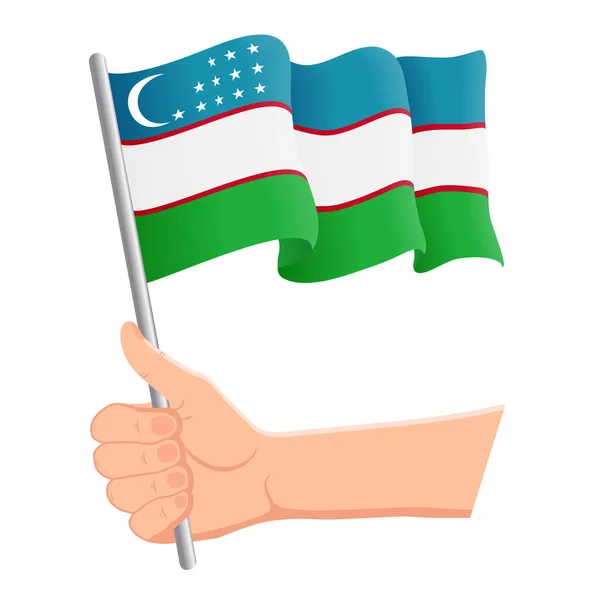 Mano sosteniendo y ondeando la bandera nacional de Uzbekistán. Aficionados, día de la independencia, concepto patriótico. Ilustración vectorial — Archivo Imágenes Vectoriales