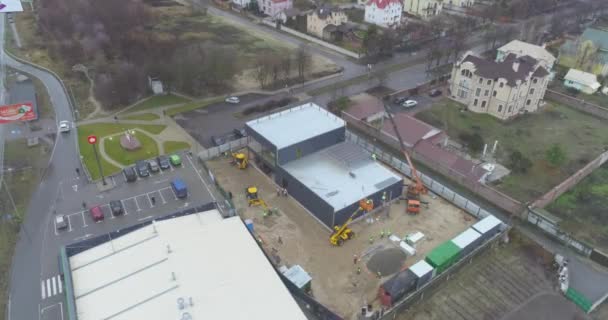 Construction of a modern store. Building construction aerial view. Modern construction — Stock Video