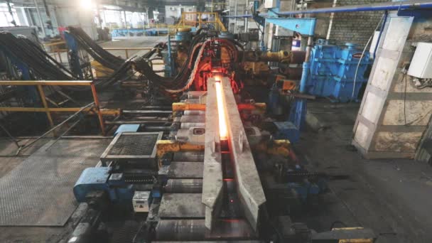 Metallurgy. Hot Metal Tubes. Hot steel pipe production line. Red hot metal pipe production process. — Stock Video