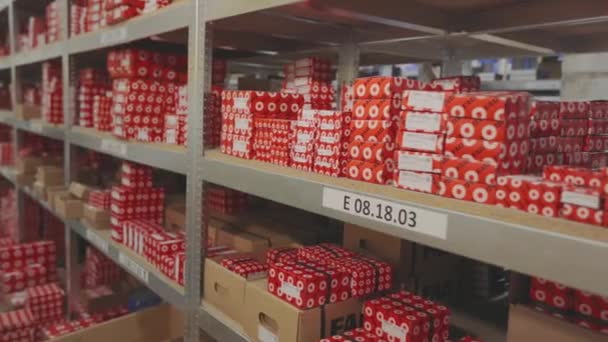 Shelves with goods in a factory warehouse. Shelves with boxes in stock — Stock Video