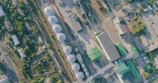 Grain storage tank view from above. Grain storage in large slots aerial view. Silo with grain. — Stock Video