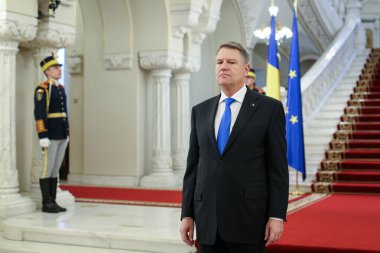 Bucharest, Romania - January 11, 2019: Romania's President Klaus Iohannis waits for European Commission President Jean-Claude Junker, at Cotroceni presidential palace in Bucharest. clipart