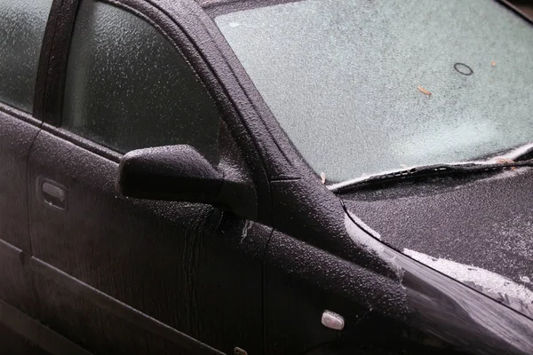 Car frozen windscreen and windscreen wipers after a freezing rain phenomenon