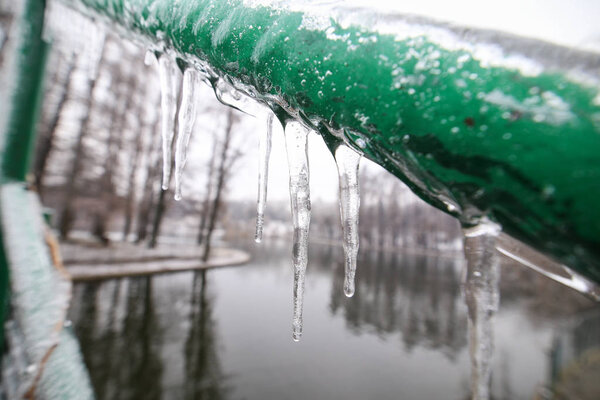 Hanging icicles after a freezing rain weather phenomenon