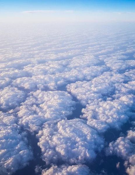 Clouds seen from above from an airplane cabin