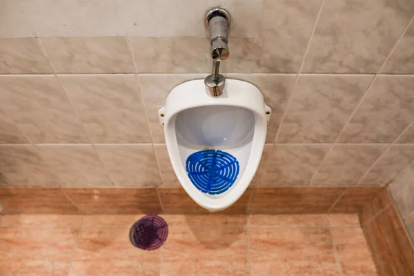 Shallow depth of field image with the urinal in a men���s restro — Stock Photo, Image