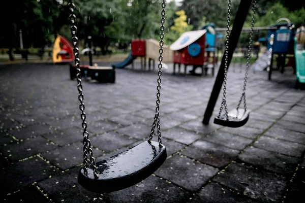 Plastic Wet Swings Empty Playground Rainy Summer Day — Stock Photo, Image