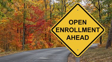 Open Enrollment Caution Sign With Autumn Road Background clipart