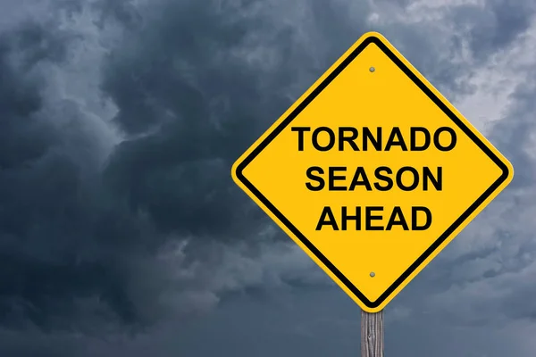 Tornado Season Ahead Caution Sign With Storm Cloud Background