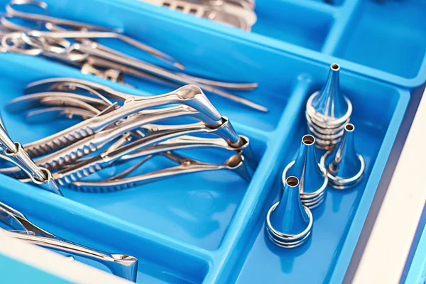 Otorhinolaryngology or ENT surgery instruments in a blue medical box