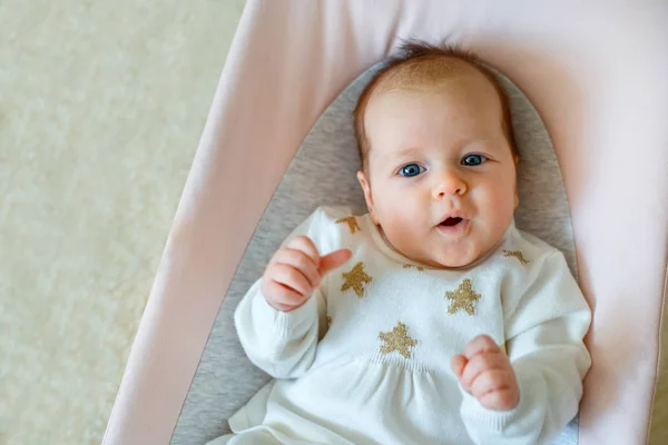 Baby girl having fun in bouncer. Activities for infants — Stock Photo, Image