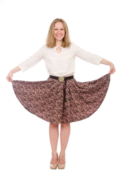 Portrait young woman with raised skirt in full length isolated over white — Stock Photo, Image
