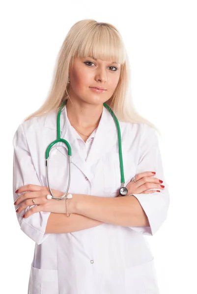 Verpleegkundige in een witte vacht met een stethoscoop armen gekruist. — Stockfoto