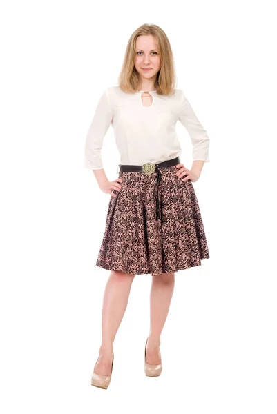 Fashion portrait of a young blonde in a skirt with hands on a belt in full growth isolated over a white — Stock Photo, Image