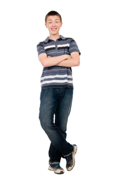 Cheerful young man with arms crossed in full growth isolated over a white — Stock Photo, Image