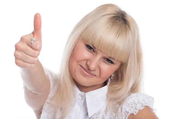 Close-up van een tevreden jonge vrouw tonen duim geïsoleerd over witte achtergrond — Stockfoto