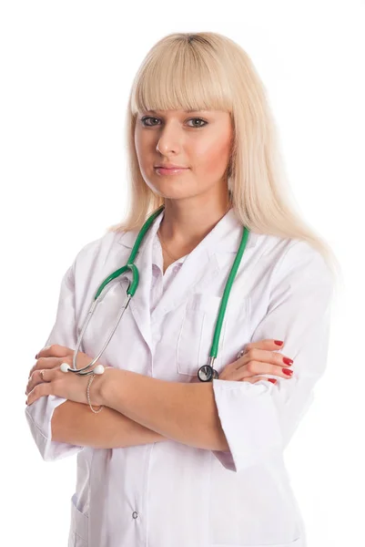 Verpleegkundige in een witte vacht met gekruiste armen. — Stockfoto