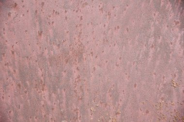 Pembe eski bir metal levhanın yakın plan arkaplanı. Arkaplan, konsept, reklam için grunge