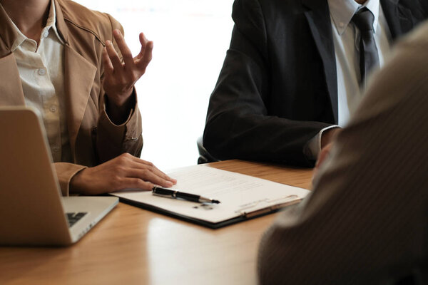 Examiner reading a resume during job interview at office Business and human resources concept.