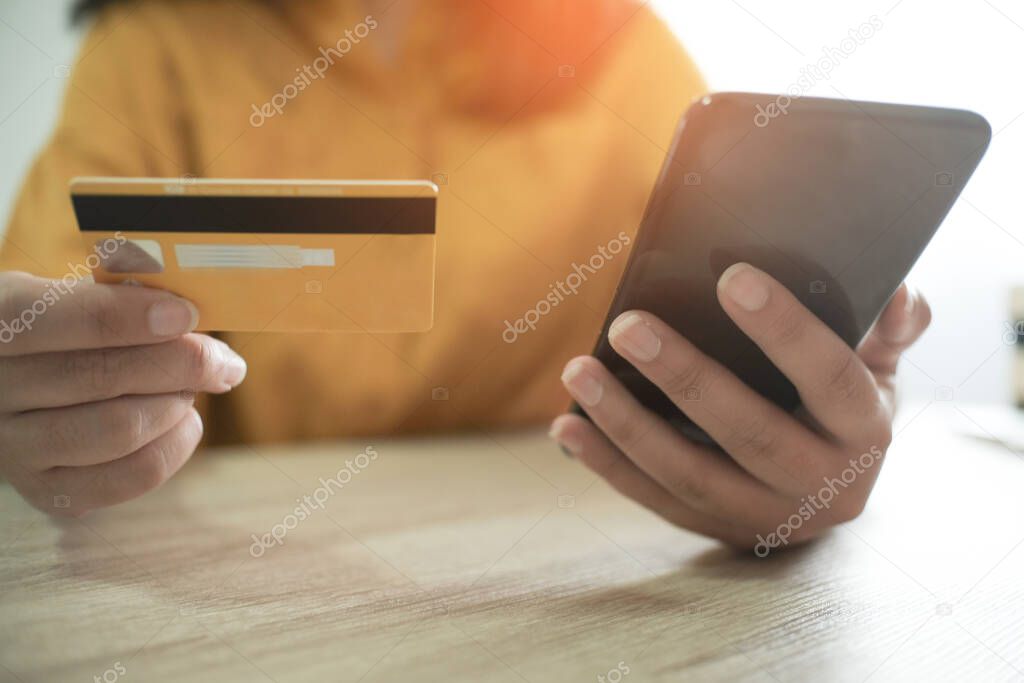 Woman and Small shopping cart with Laptop for Internet online shopping concept