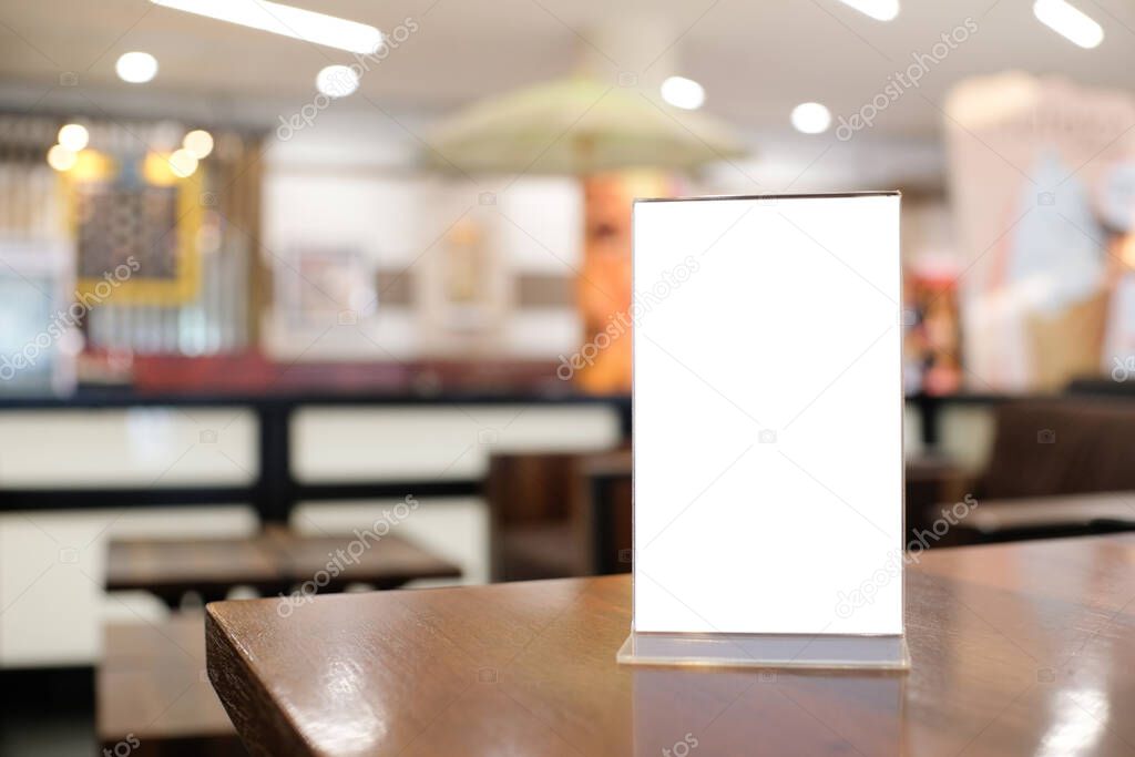 Menu frame space for text marketing promotion standing on wood table in Bar restaurant cafe