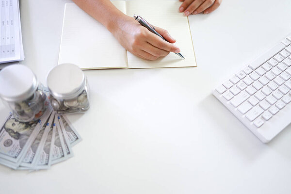 Saving money concept Financial woman hand stack coins money banknotes  growing business. cash money in dollar banknotes