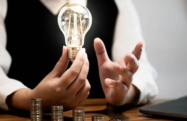 saving coins idea with light bulb for investment Concept idea and innovation