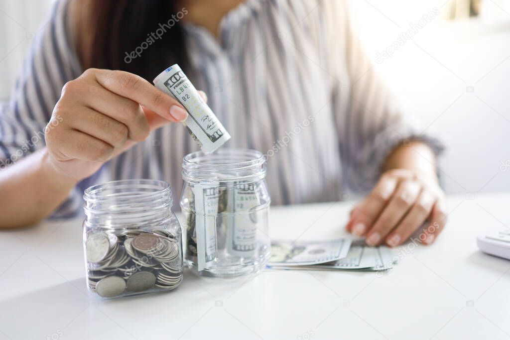 Saving money concept Financial woman hand stack coins money banknotes  growing business. cash money in dollar banknotes