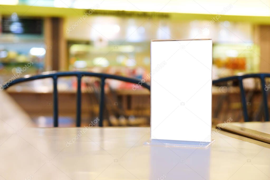 Menu frame standing on wood table in Bar restaurant cafe. space for text marketing promotion