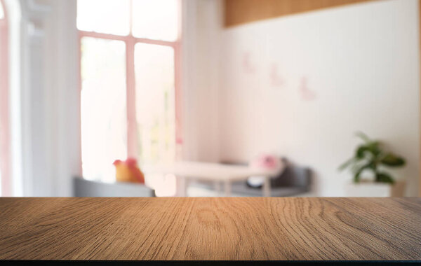 Empty dark wooden table in front of abstract blurred bokeh background of restaurant . can be used for display or montage your products.Mock up for space 