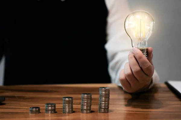 saving coins idea with light bulb for investment Concept idea and innovation
