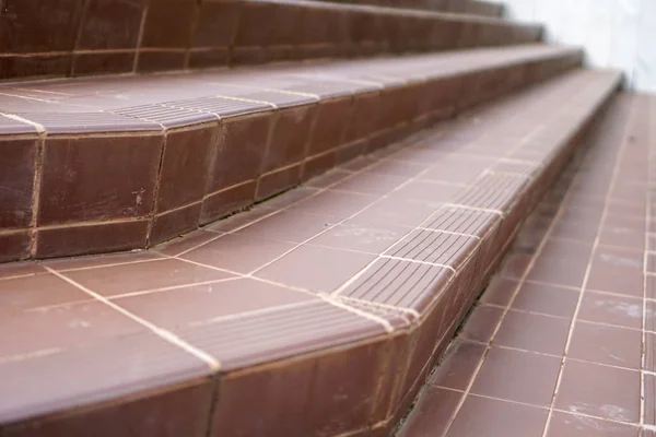 Old tile stairs with tile surface.