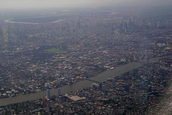 Image of plane window View of the village from the bird\'s eye view, Bangkok City, Thailand