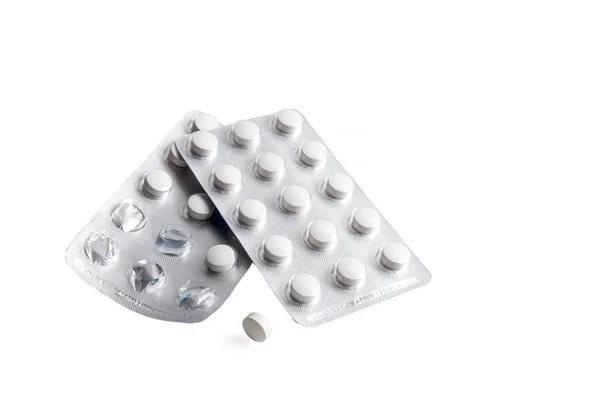 Förpackning av tabletter på en vit bakgrund — Stockfoto