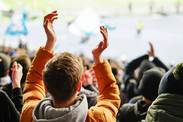 Football fans clapping on the podium of the stadium — Stock Photo, Image