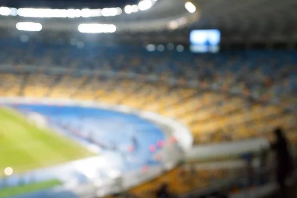 Blur image of soccer stadium in twilight time for abstract background usage. — Stock Photo, Image