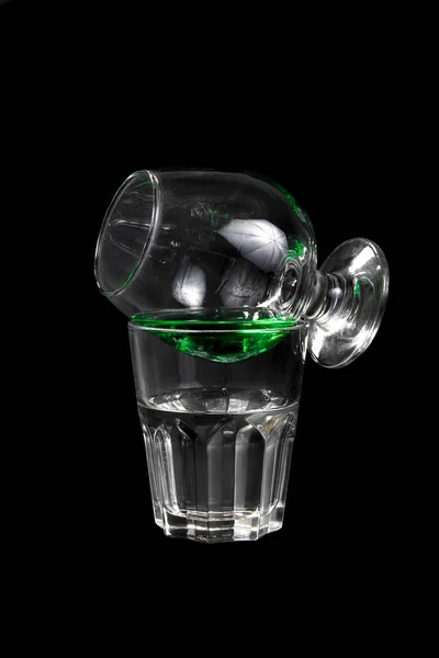 Cocktail with absinthe glass on glass isolated black — Stock Photo, Image