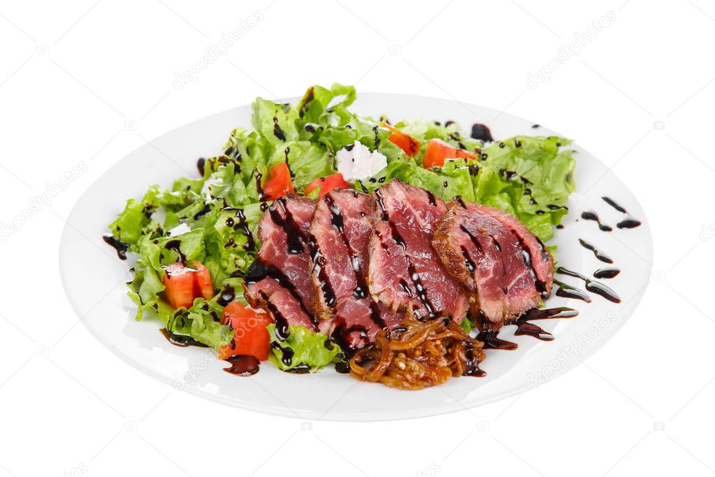 Salad with roast beef on plate white isolated