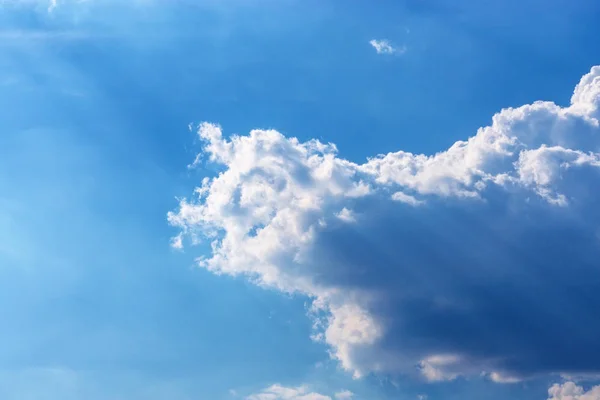 Cloud on blue sky rays of sunlight background — Stock Photo, Image